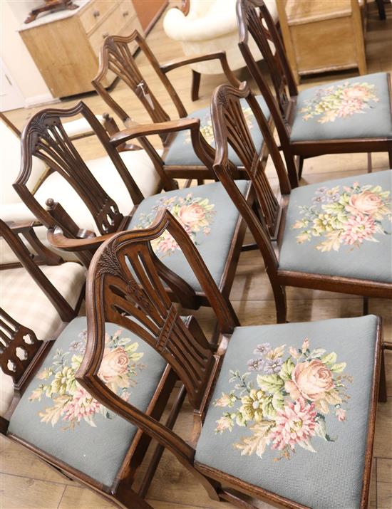 A set of six Hepplewhite style mahogany dining chairs, including two carvers, with drop-in seats